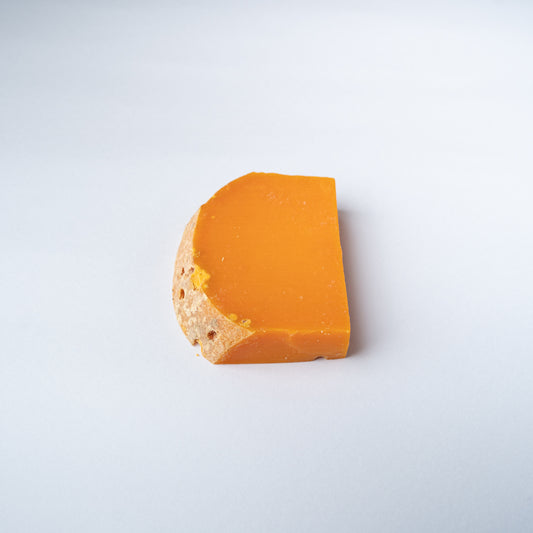 A 200g wedge of Mimolette Vieille.