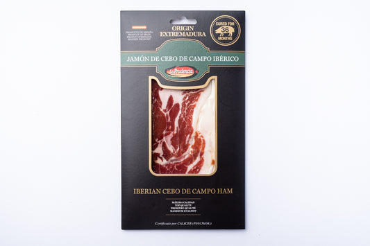 A cardboard sleeve of Jamon Iberico 36 Months 75g with a window showing the ham.