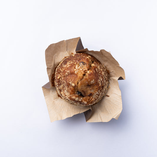 A Blueberry Muffin in purple paper.
