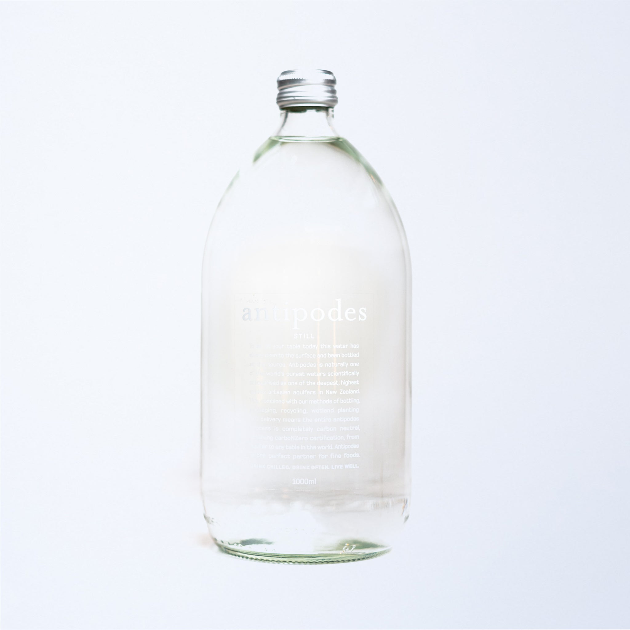 a 1l glass bottle of antipodes still water.