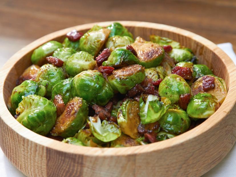 Brussels sprouts with lardons in a wooden bowl.