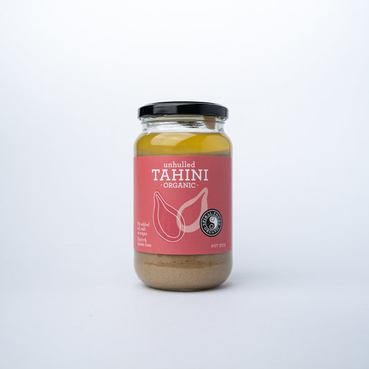 A glass jar of Spiral Unhulled Tahini 375g.