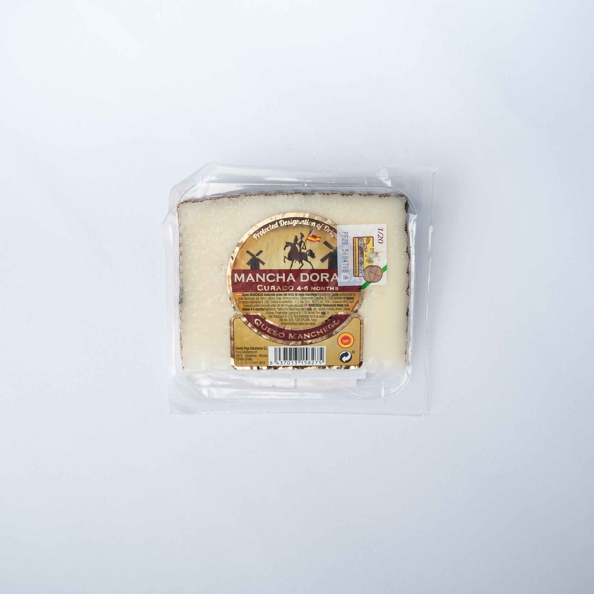 A 150g wedge of Vega Mancha Manchego cheese in shrink wrap.
