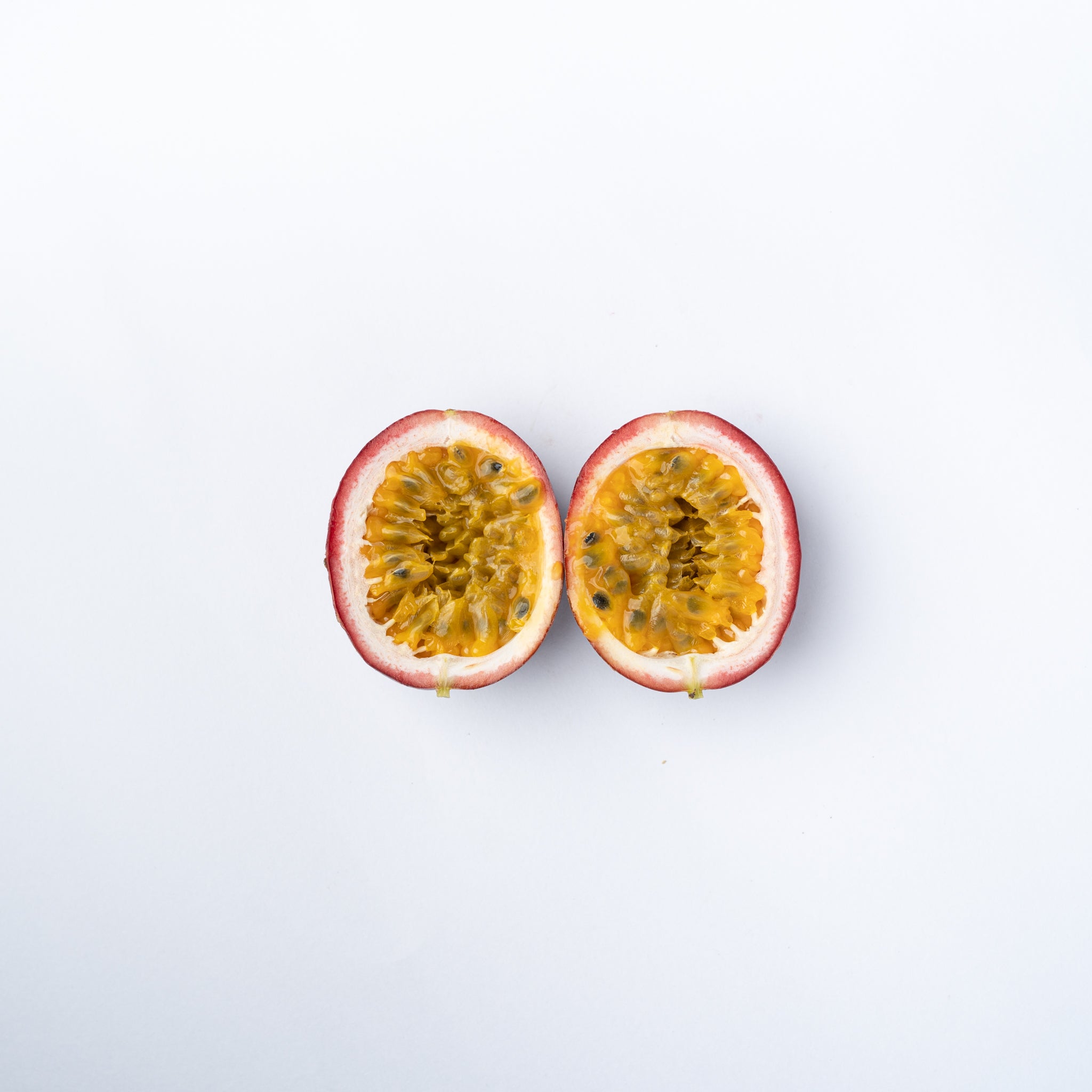 A passion fruit cut in half.