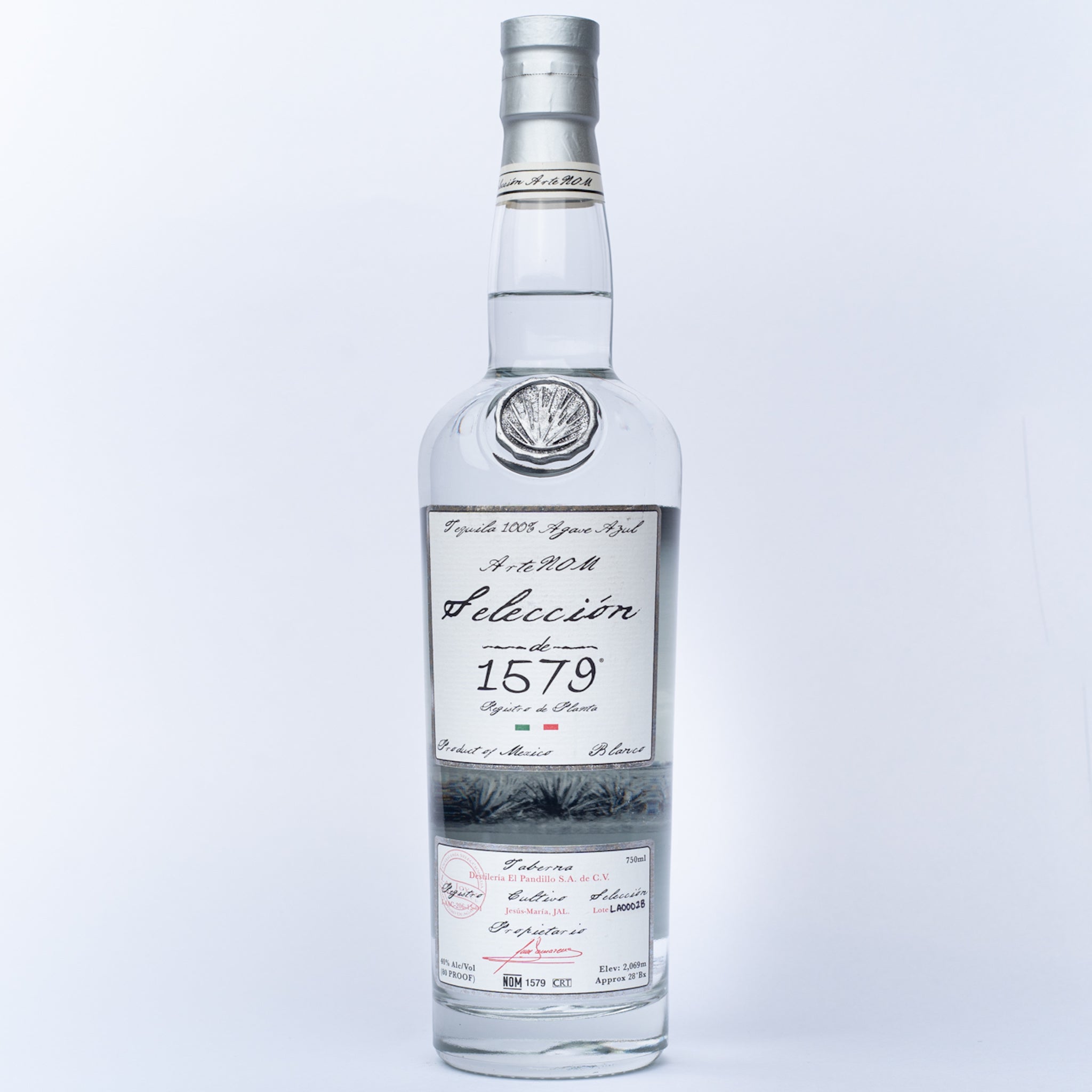 A glass bottle of Seleccion 1579 Tequila.