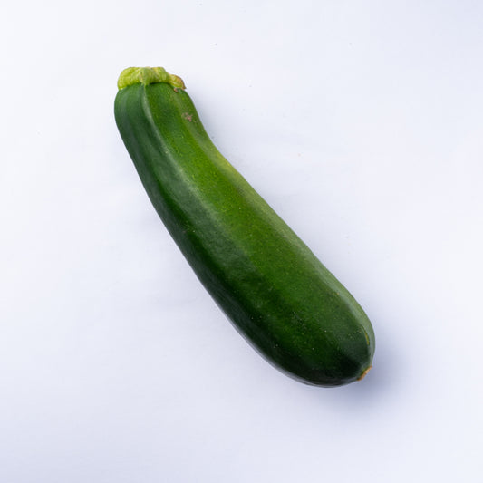 One green zucchini.