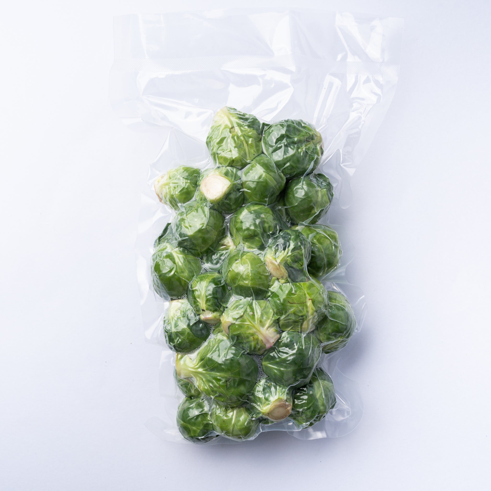 A vacuum bag of raw brussels sprouts.