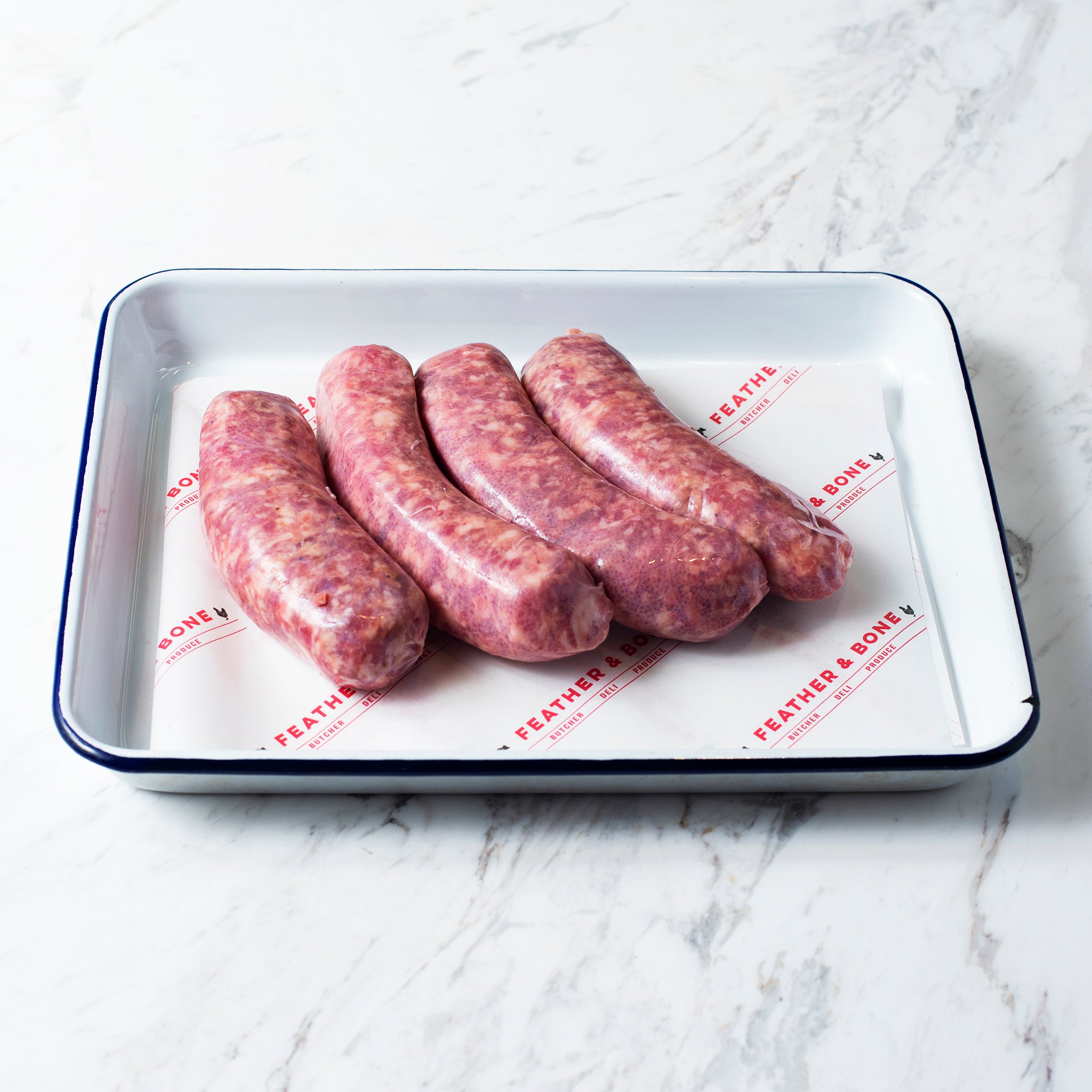 An enamel tray of Toulouse Sausages.