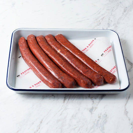 Merguez Sausages (Mutton & Beef) 520g on an enamel tray.