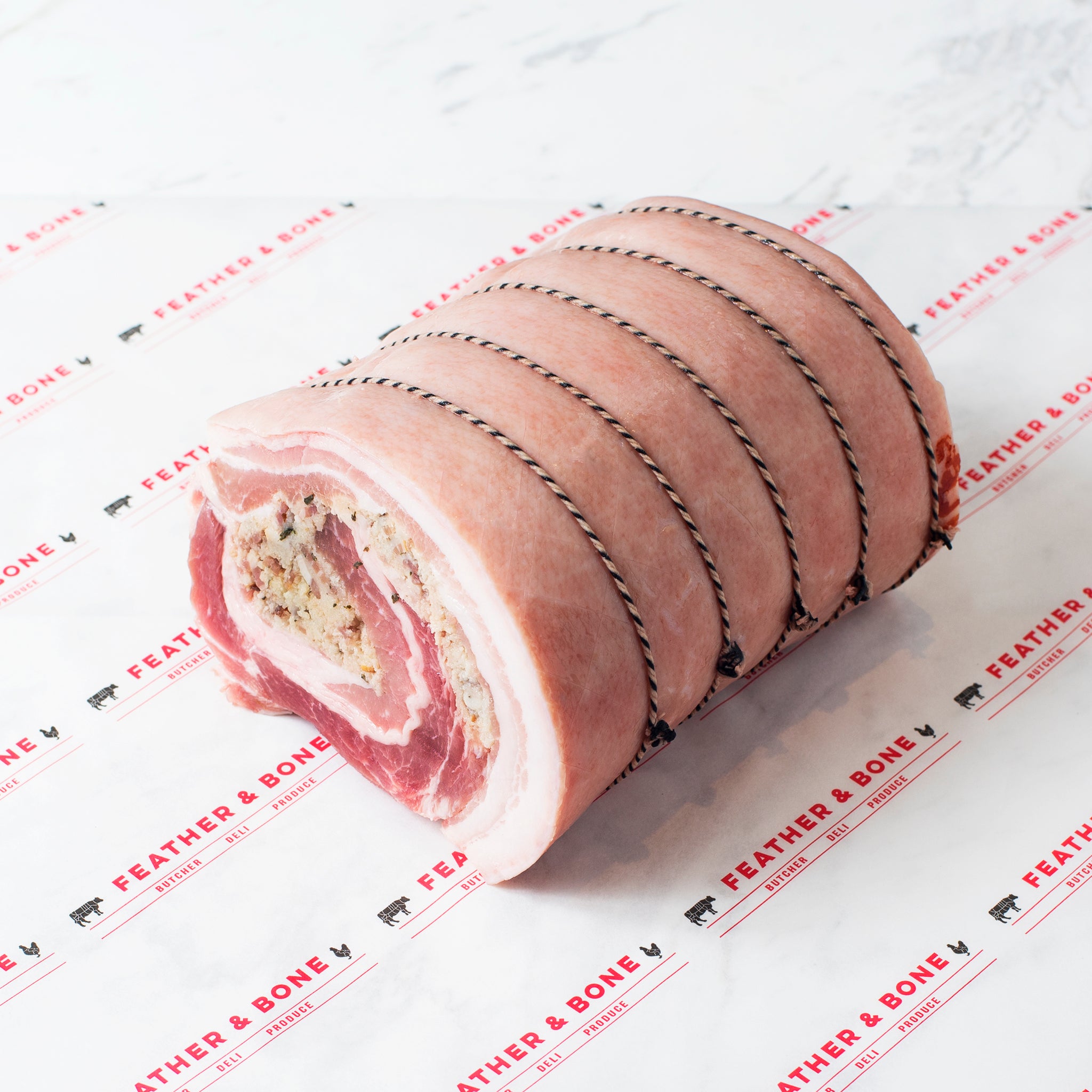 A rolled and tied Porchetta.